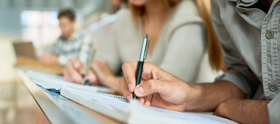 Student Writing Lecture Close Up