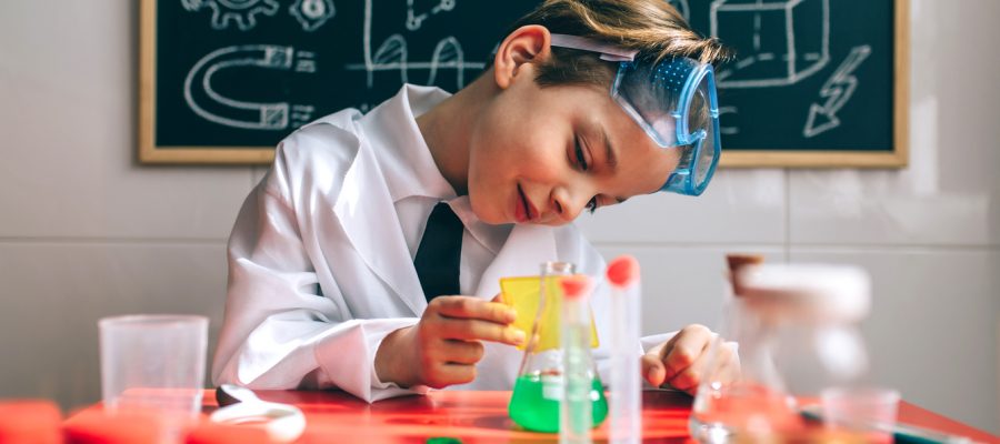 Boy playing with chemistry game